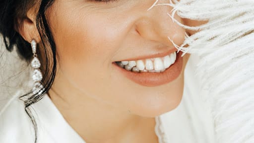 woman whitening teeth